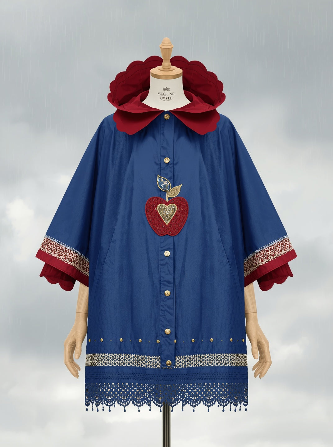 FAIREST poncho in storybook blue with red scalloped hood and gold apple embroidery