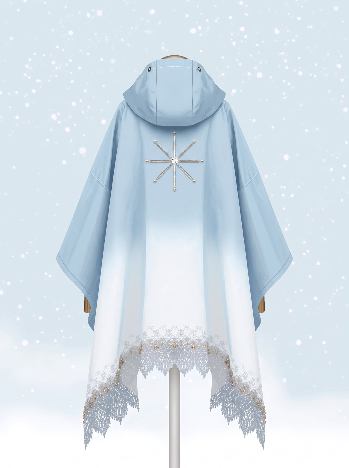 FROST poncho from the back: ice blue fading to snow-white with a beaded star snowflake medallion and lace hem